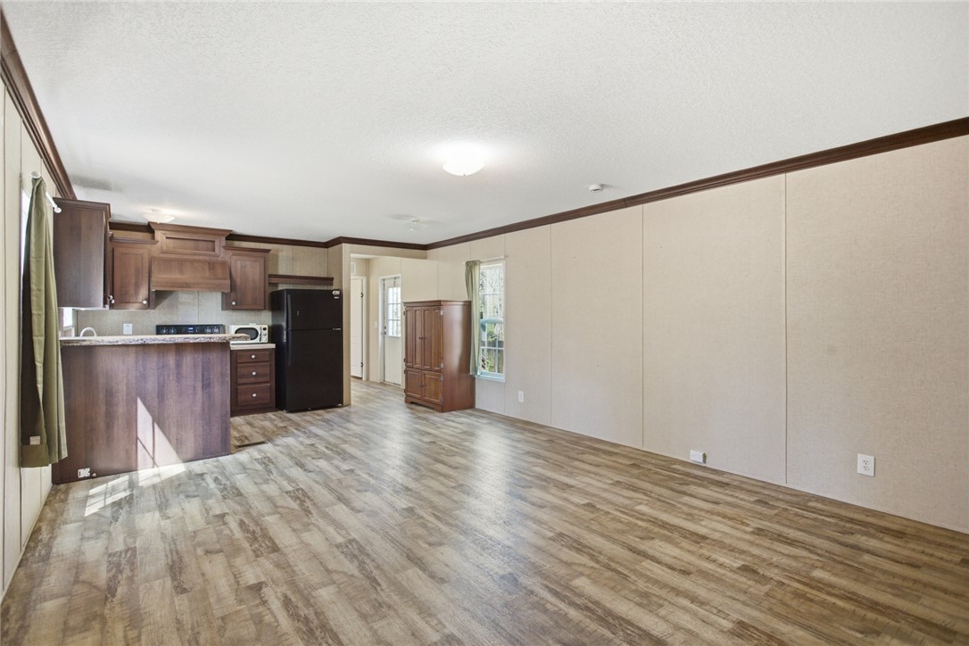 289 Bauknight Road Mountain Rest, SC 29664 - Photo 6 of 36 This inviting space combines kitchen and living areas, featuring a convenient breakfast bar.