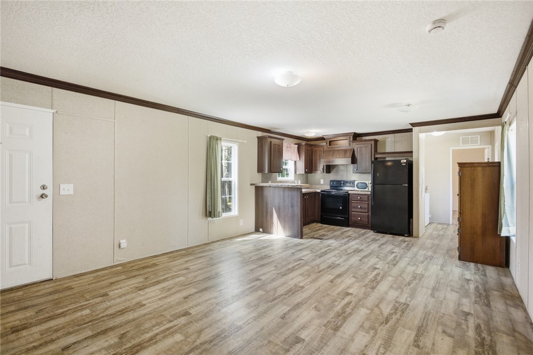 289 Bauknight Road Mountain Rest, SC 29664 - Photo 10 of 36 This inviting space combines a functional kitchen with a comfortable living area, ideal for everyday living.