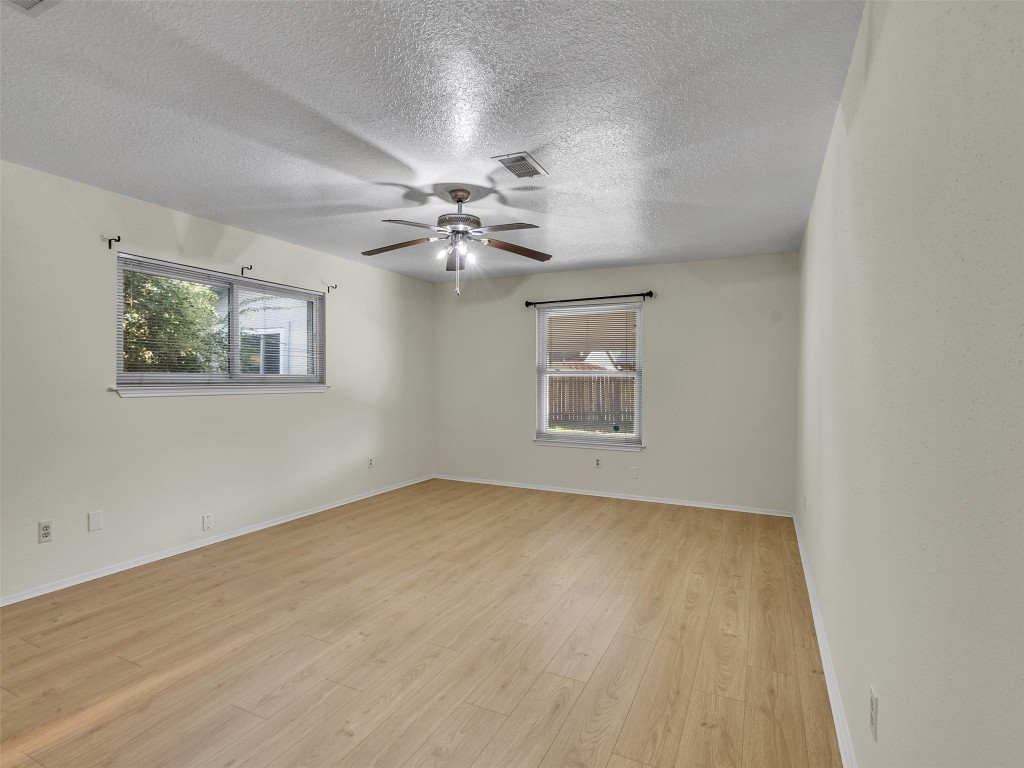 32 Sarita Road Angleton, TX 77515 - Photo 11 of 25 a view of an empty room with a chandelier fan