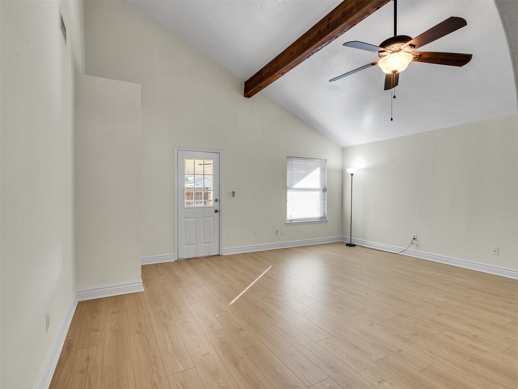 32 Sarita Road Angleton, TX 77515 - Photo 18 of 25 an empty room with windows and fan