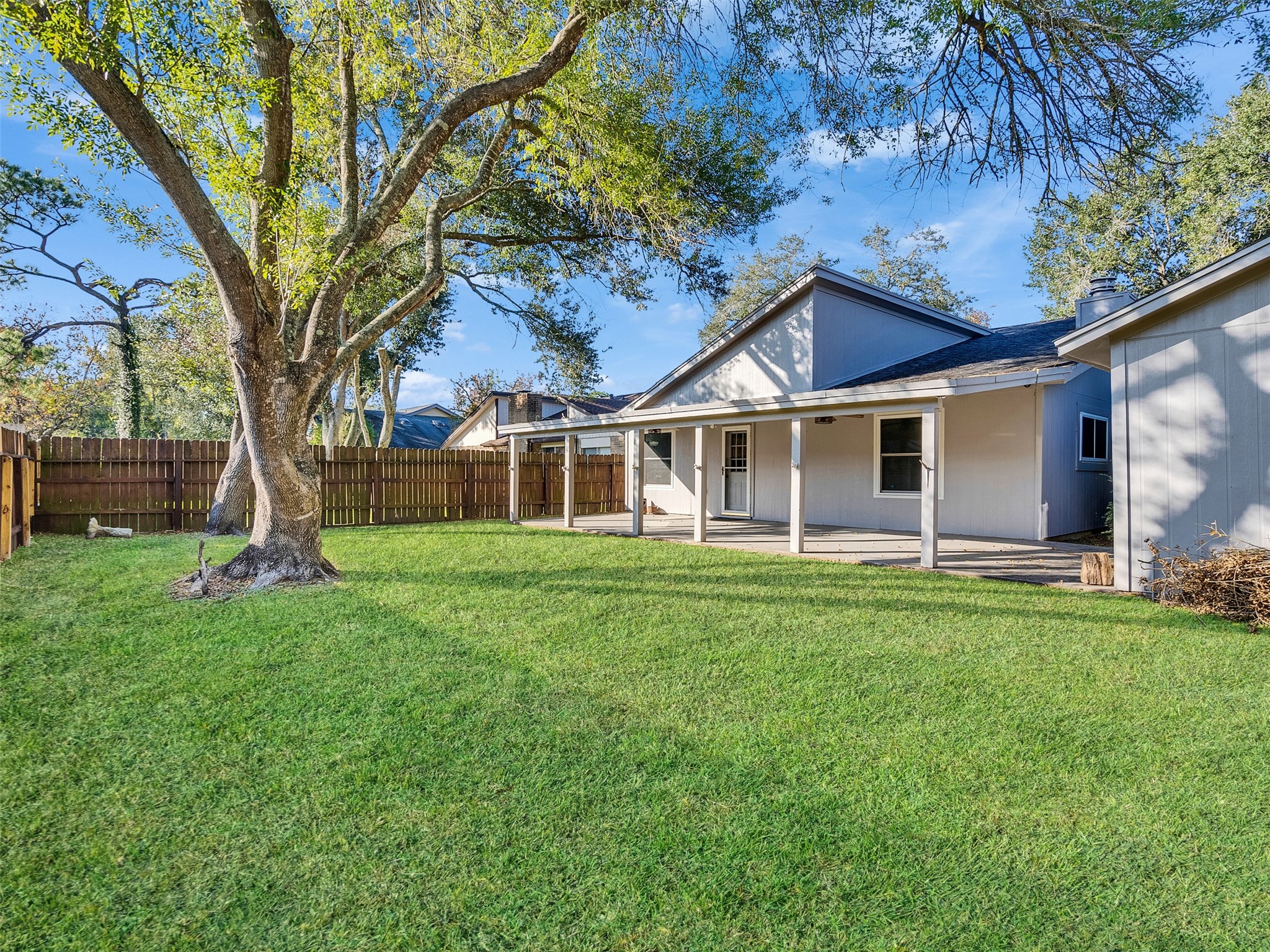 32 Sarita Road Angleton, TX 77515 - Photo 23 of 25 a front view of a house with a yard and tree