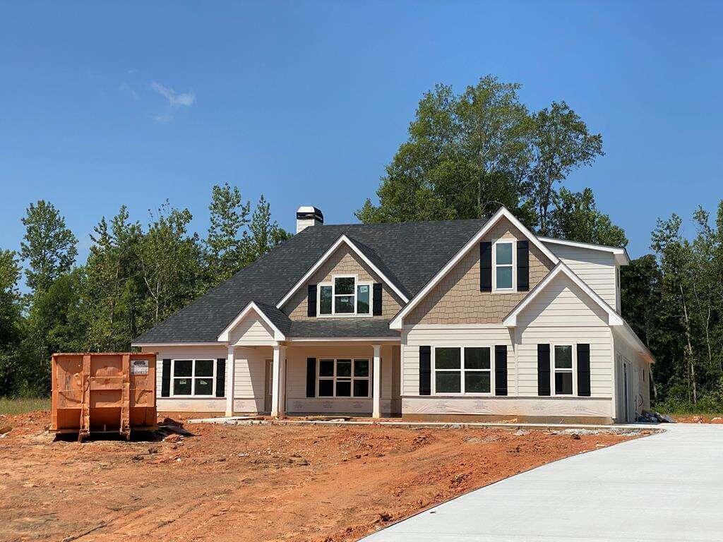 579 Sandhill Hulett Road Villa Rica, GA 30180 - Photo 1 of 1 a front view of a house with a garden