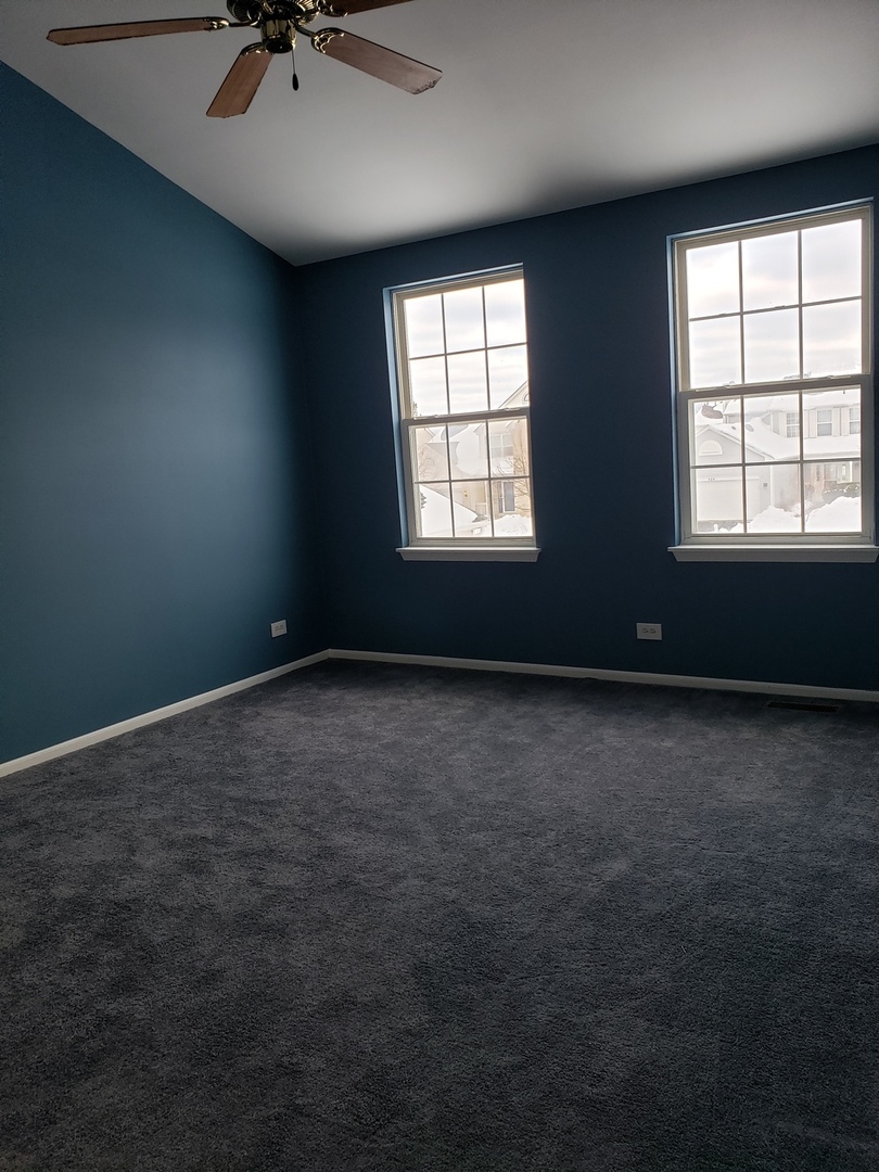 334 Spring Valley Way Round Lake, IL 60073 - Photo 15 of 26 an empty room with a window