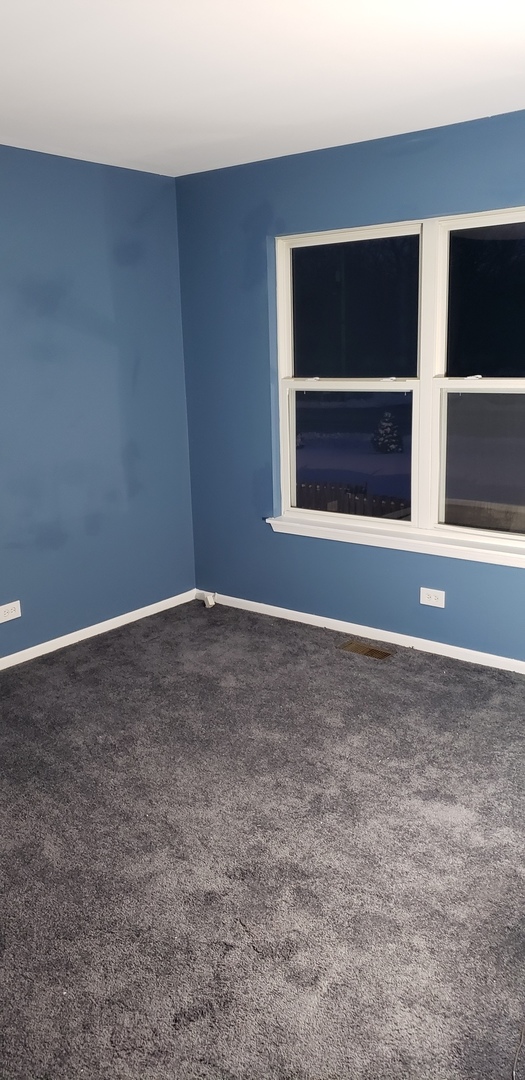 334 Spring Valley Way Round Lake, IL 60073 - Photo 20 of 26 a view of an empty room with a window