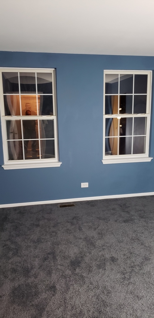334 Spring Valley Way Round Lake, IL 60073 - Photo 22 of 26 a view of an empty room with a window