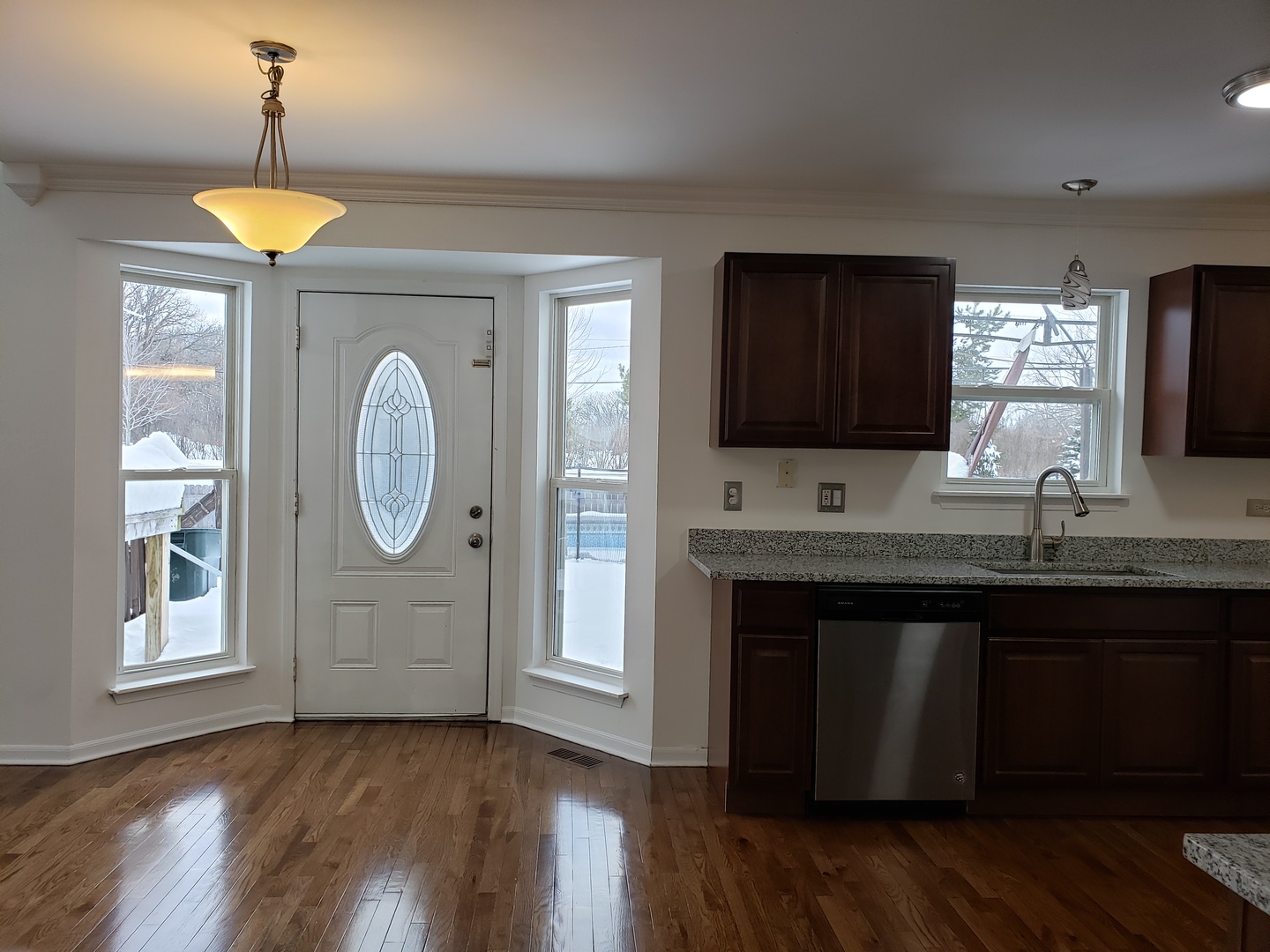 334 Spring Valley Way Round Lake, IL 60073 - Photo 8 of 26 a kitchen with wooden floors and a sink