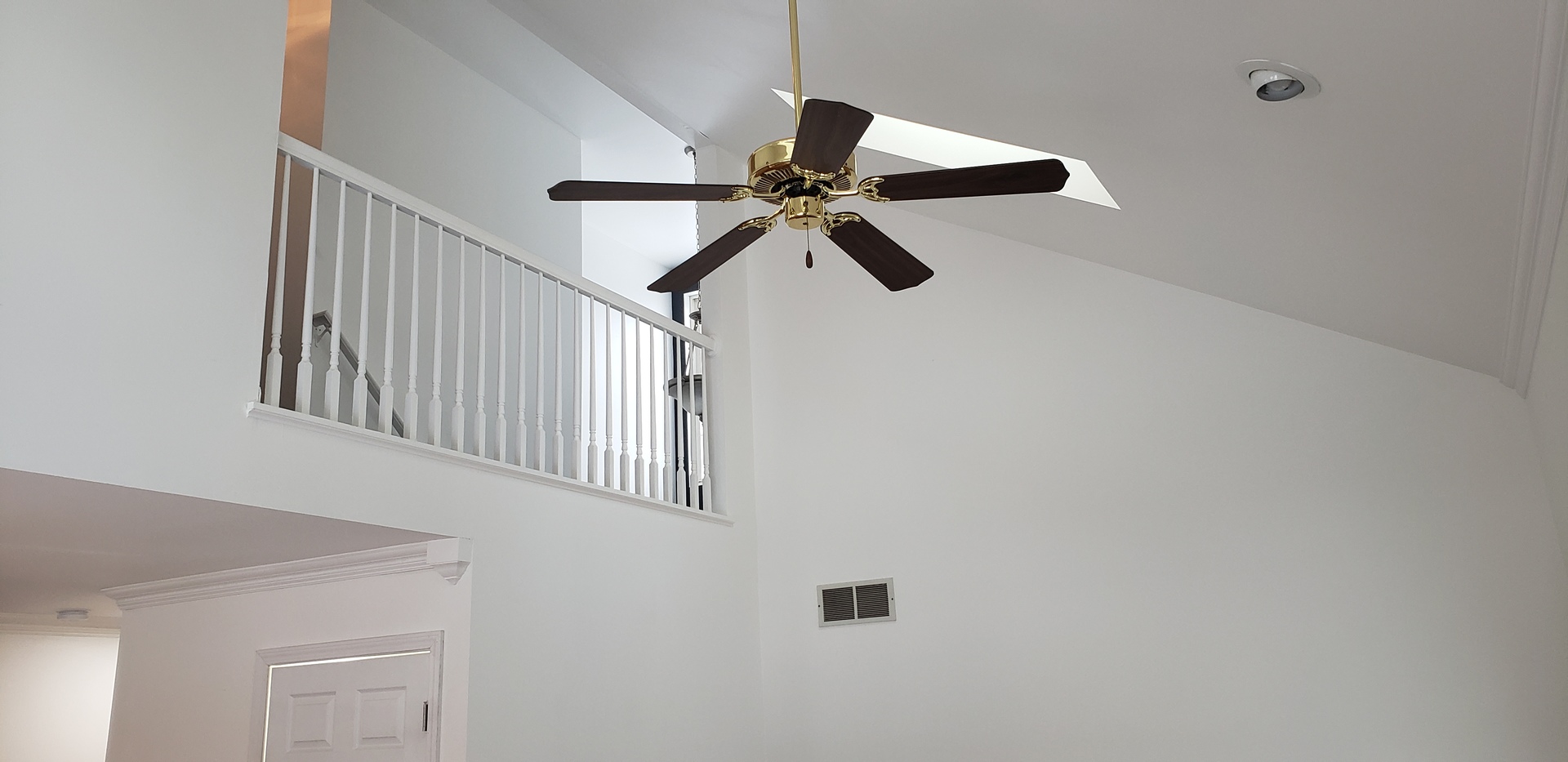 334 Spring Valley Way Round Lake, IL 60073 - Photo 10 of 26 a view of a hallway with a ceiling fan