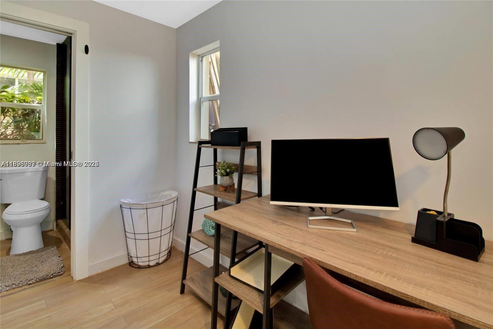 833 West 39th Street, Unit 5 Miami Beach, FL 33140 - Photo 9 of 12 a view of a workspace with furniture