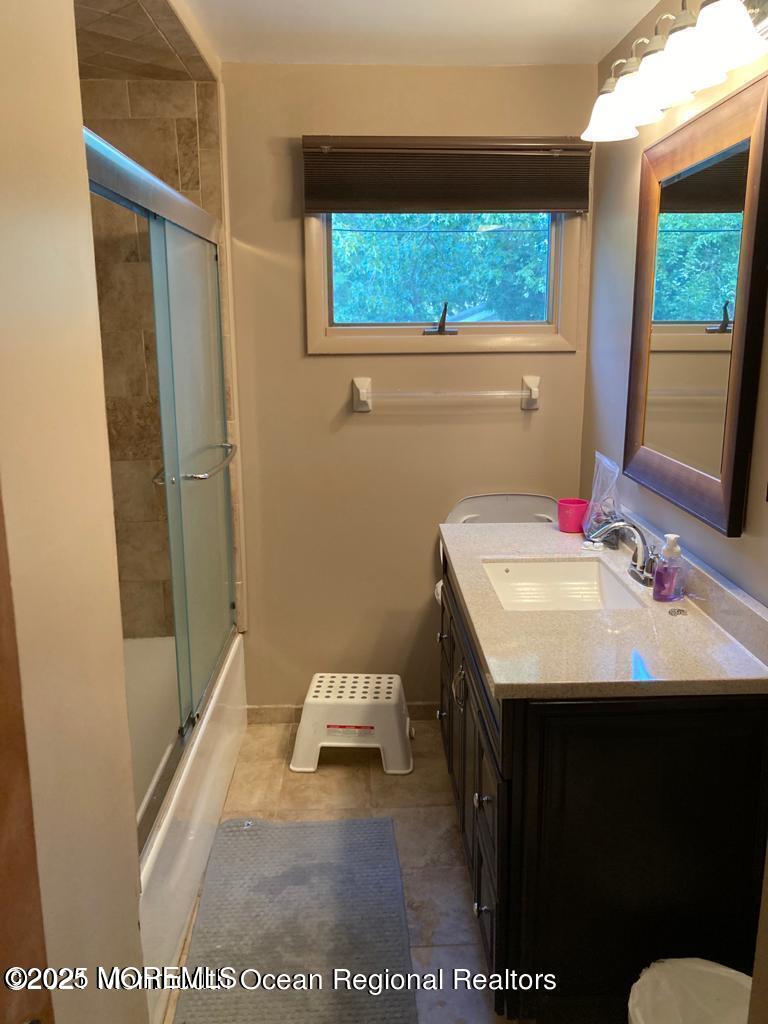 2 Lloyd Place Oakhurst, NJ 07755 - Photo 3 of 4 a bathroom with a sink and a mirror