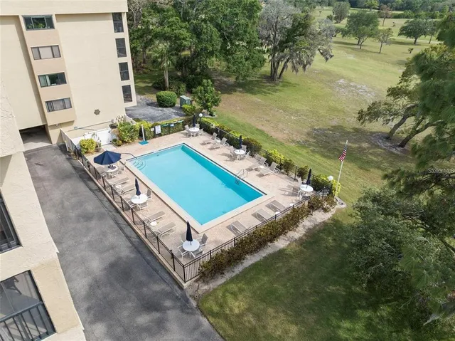 a front view of a building with a garden
