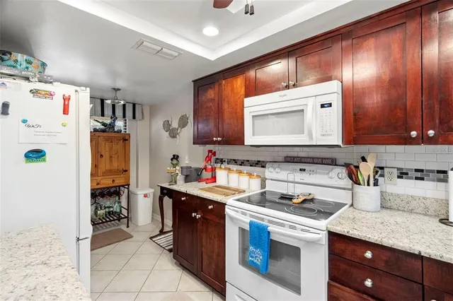a kitchen with a sink a stove and refrigerator