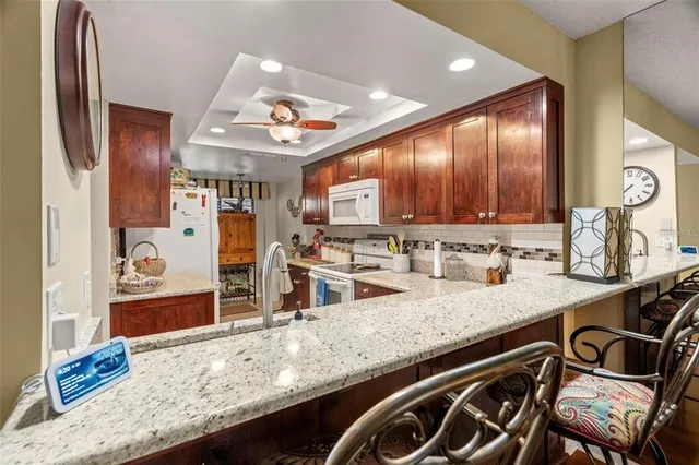 a view of a dining area with furniture and wooden floor