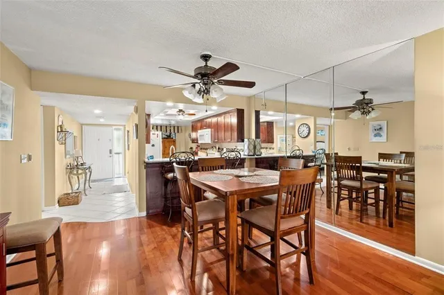 a view of a hallway to a livingroom with furniture