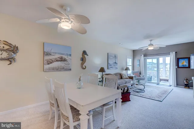 a kitchen with a refrigerator and cabinets