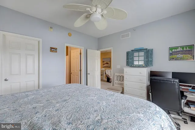 a view of walk in closet with clothes