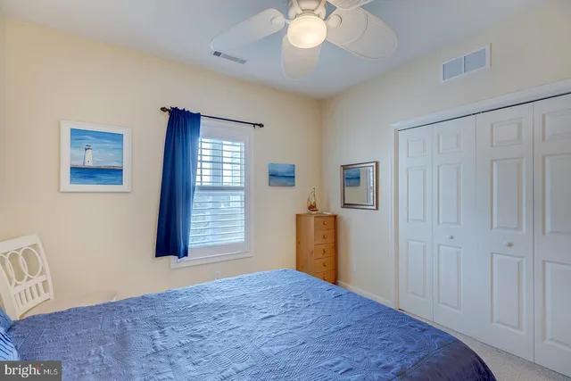 a front view of a house with a yard table and chairs