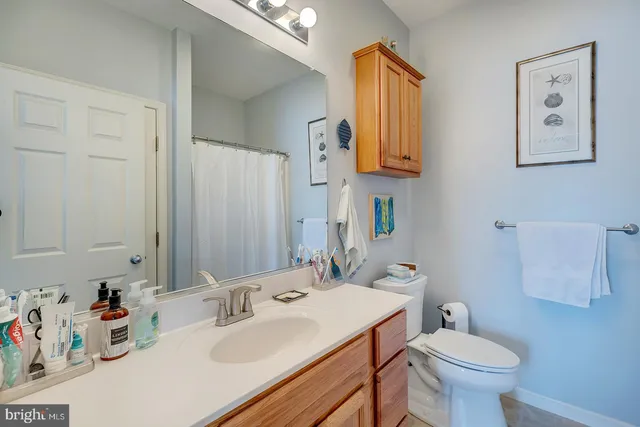 an aerial view of residential houses with outdoor space and swimming pool