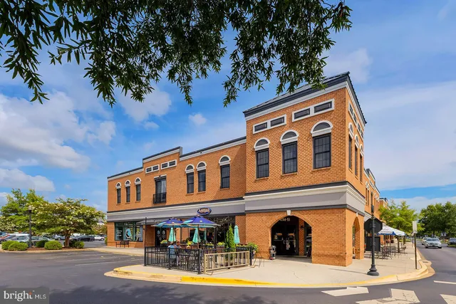 a view of swimming pool with outdoor seating