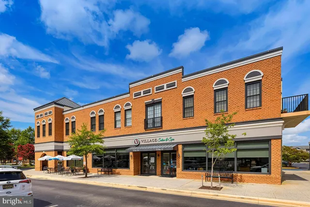 a view of a swimming pool with lounge chairs