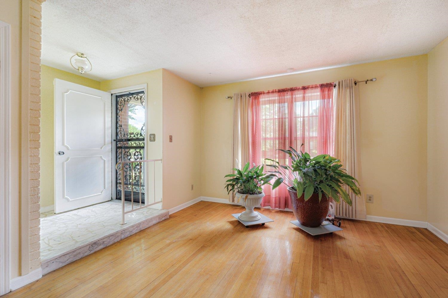 5040 Warrington Road Memphis, TN 38118 - Photo 5 of 29 Interior space with wood-type flooring, baseboards, and a healthy amount of sunlight