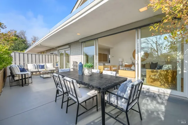 a view of an outdoor dining space with furniture