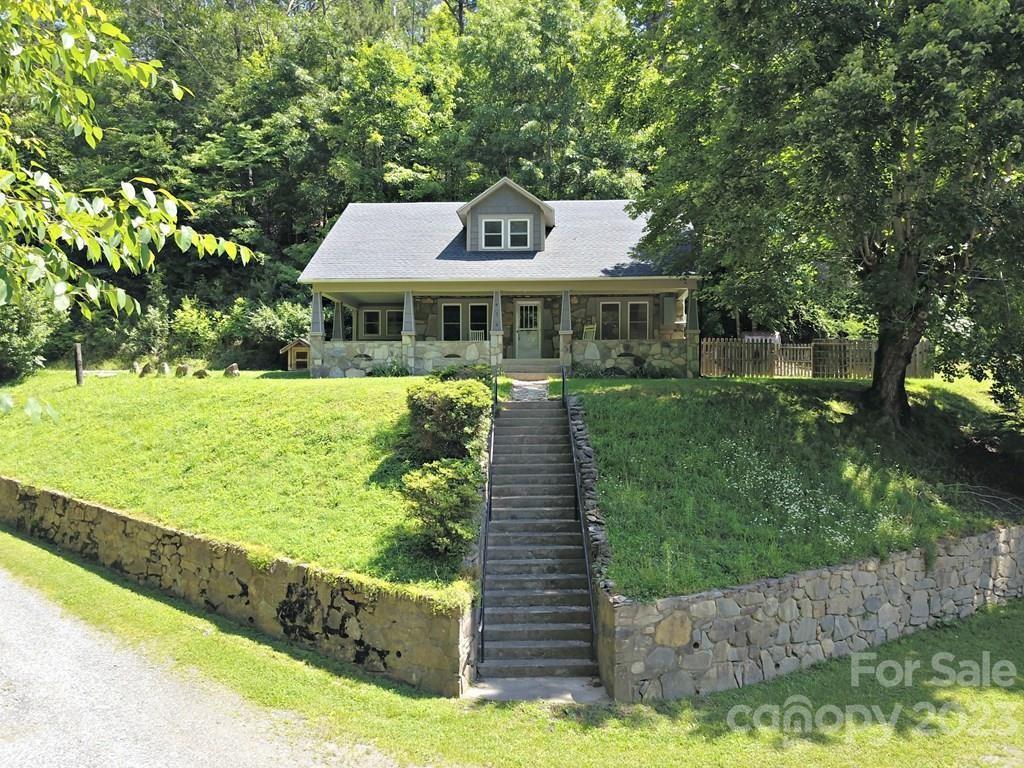 34 Coosa Rdg Drive Whittier, NC 28789 - Photo 1 of 44 a front view of a house with a yard
