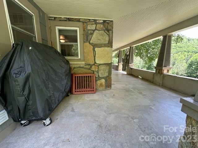 34 Coosa Rdg Drive Whittier, NC 28789 - Photo 15 of 44 a view of a porch with furniture and a gate