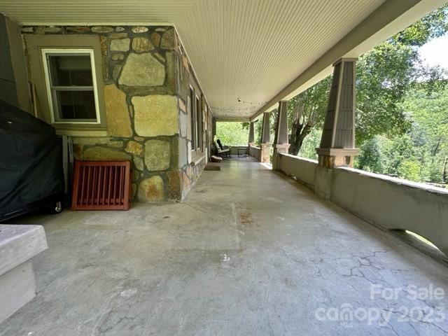 34 Coosa Rdg Drive Whittier, NC 28789 - Photo 17 of 44 a view of a porch with furniture and floor to ceiling window