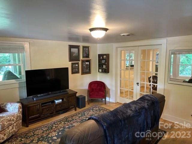 34 Coosa Rdg Drive Whittier, NC 28789 - Photo 24 of 44 a living room with a couch and a flat screen tv
