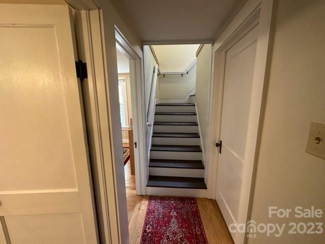 34 Coosa Rdg Drive Whittier, NC 28789 - Photo 32 of 44 a view of a hallway with wooden floor and stairs