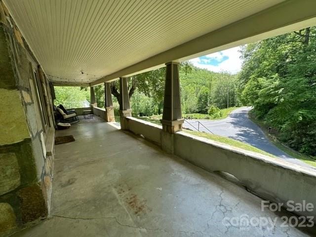 34 Coosa Rdg Drive Whittier, NC 28789 - Photo 4 of 44 a view of a porch with furniture and garden