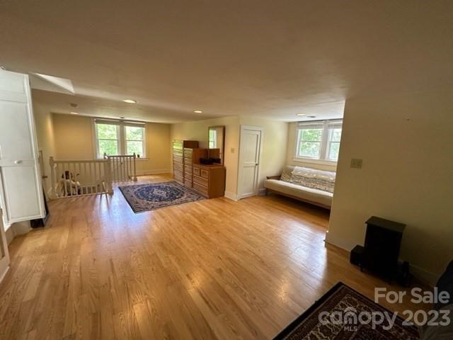 34 Coosa Rdg Drive Whittier, NC 28789 - Photo 43 of 44 a view of a living room and a kitchen with furniture wooden floor
