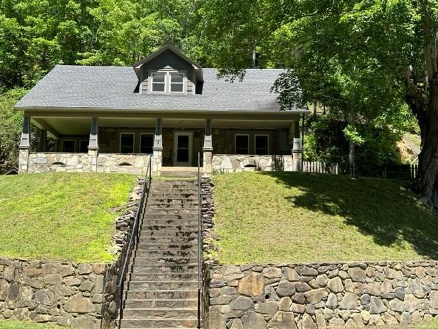 34 Coosa Rdg Drive Whittier, NC 28789 - Photo 6 of 44 a front view of a house with garden