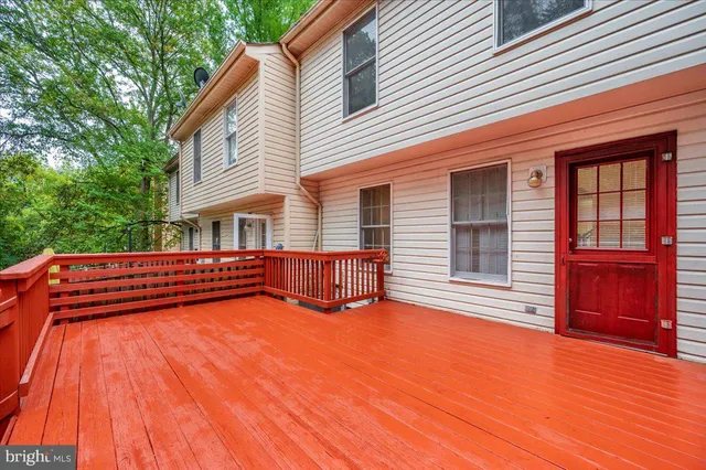 a view of a house with pool and wooden floor