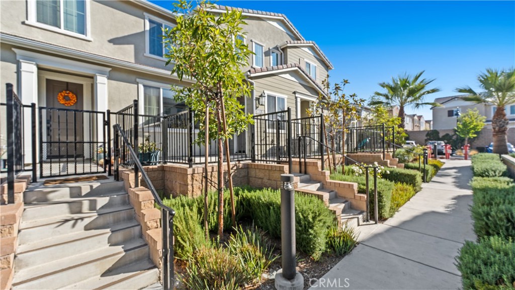5604 Altamura Way, Unit 8 Fontana, CA 92336 - Photo 2 of 18 a view of a chairs and tables in the patio