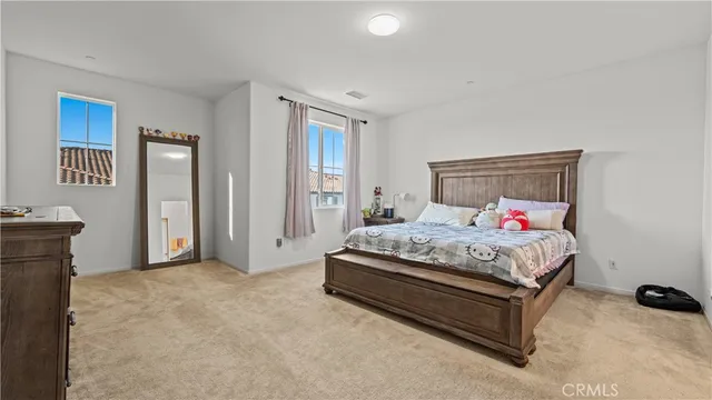 a bedroom with a bed and a table