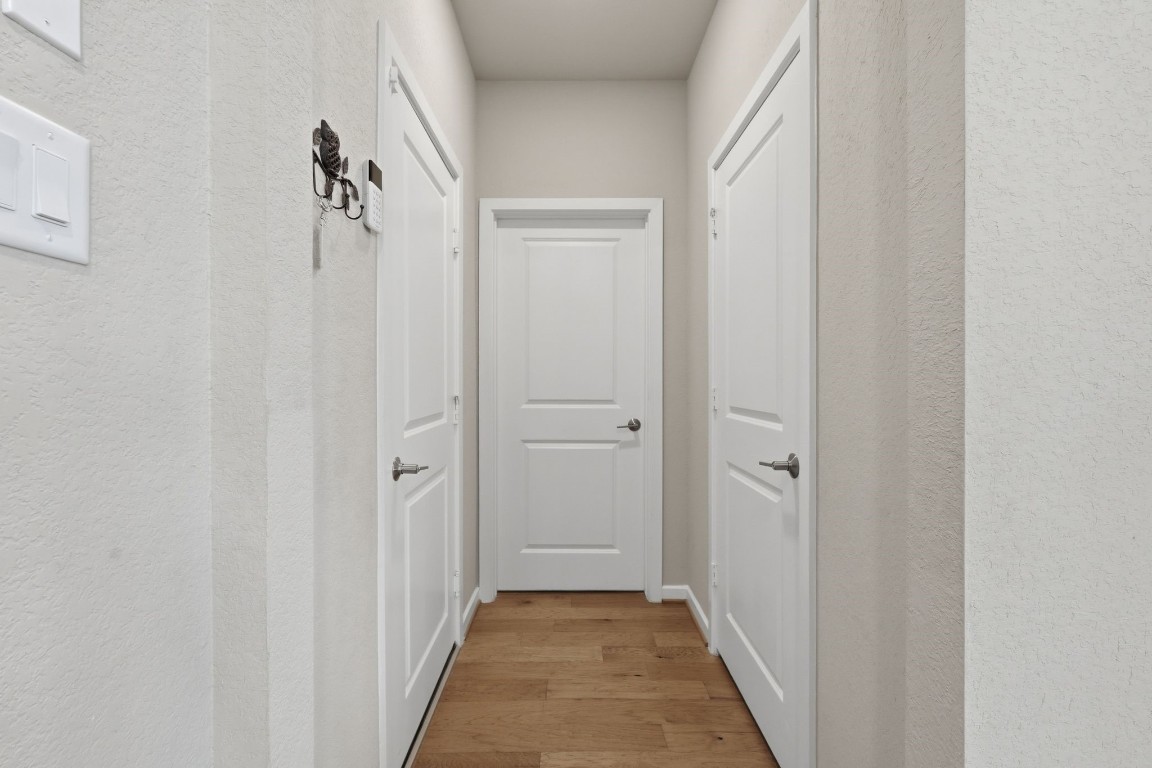 22006 Raburn Ranch Tomball, TX 77375 - Photo 24 of 50 Hallway to the garage, laundry, and half bath.