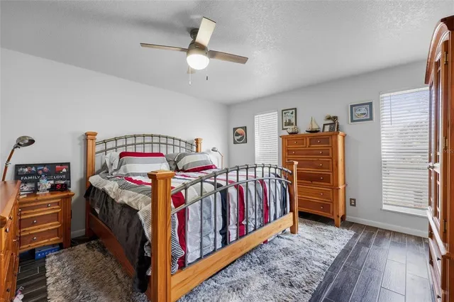 a bedroom with furniture and baby crib