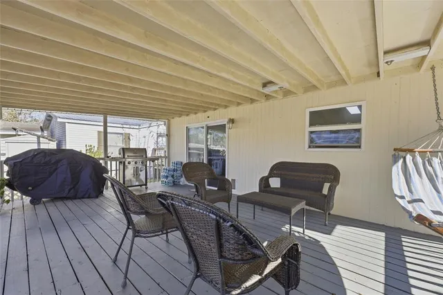 a view of a livingroom with furniture and lounge chair