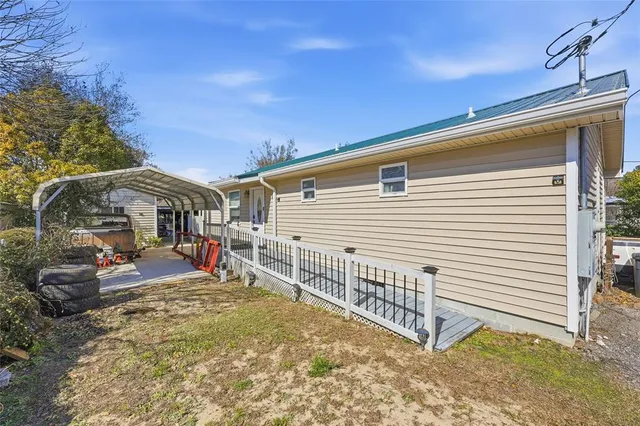 a view of a house with backyard and porch