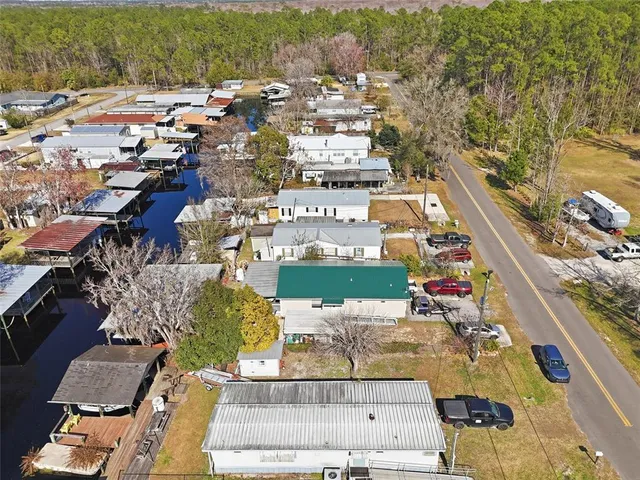 an aerial view of a house with a garden