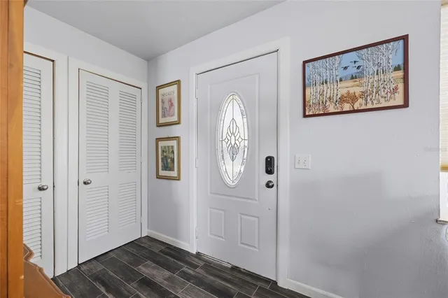 a view of front door with wooden floor