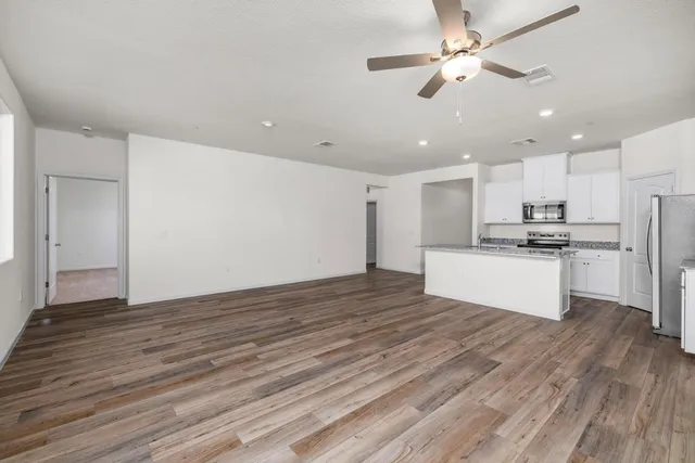 a view of kitchen with wooden floor and window