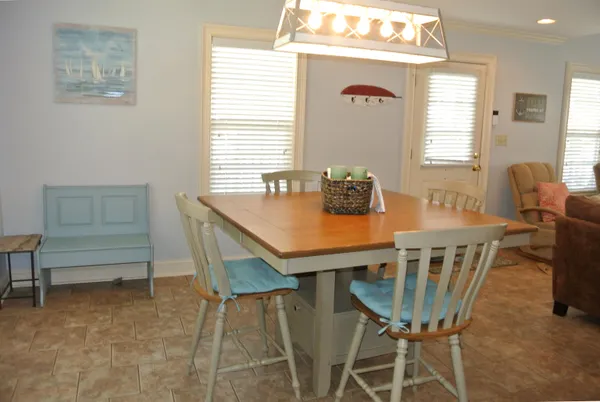 a view of a dining room with furniture and window