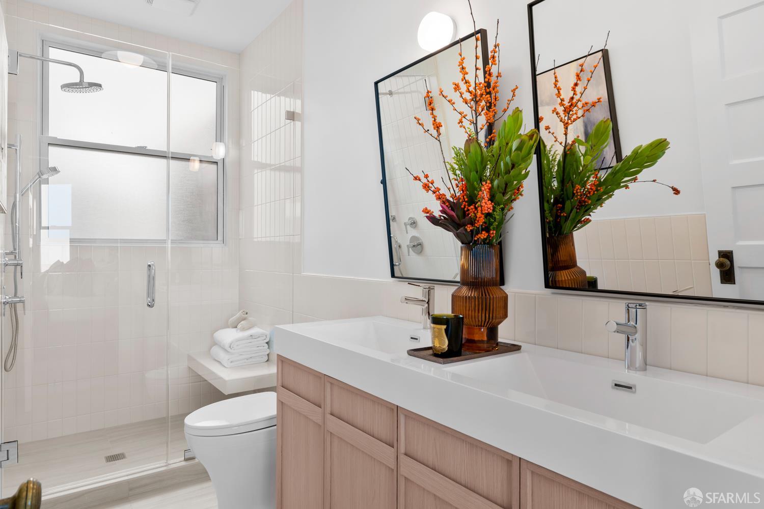 2650 Union Street San Francisco, CA 94123 - Photo 11 of 14 a bathroom with a sink a toilet and a mirror