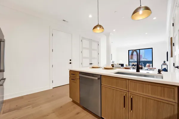 a kitchen with a sink and cabinets