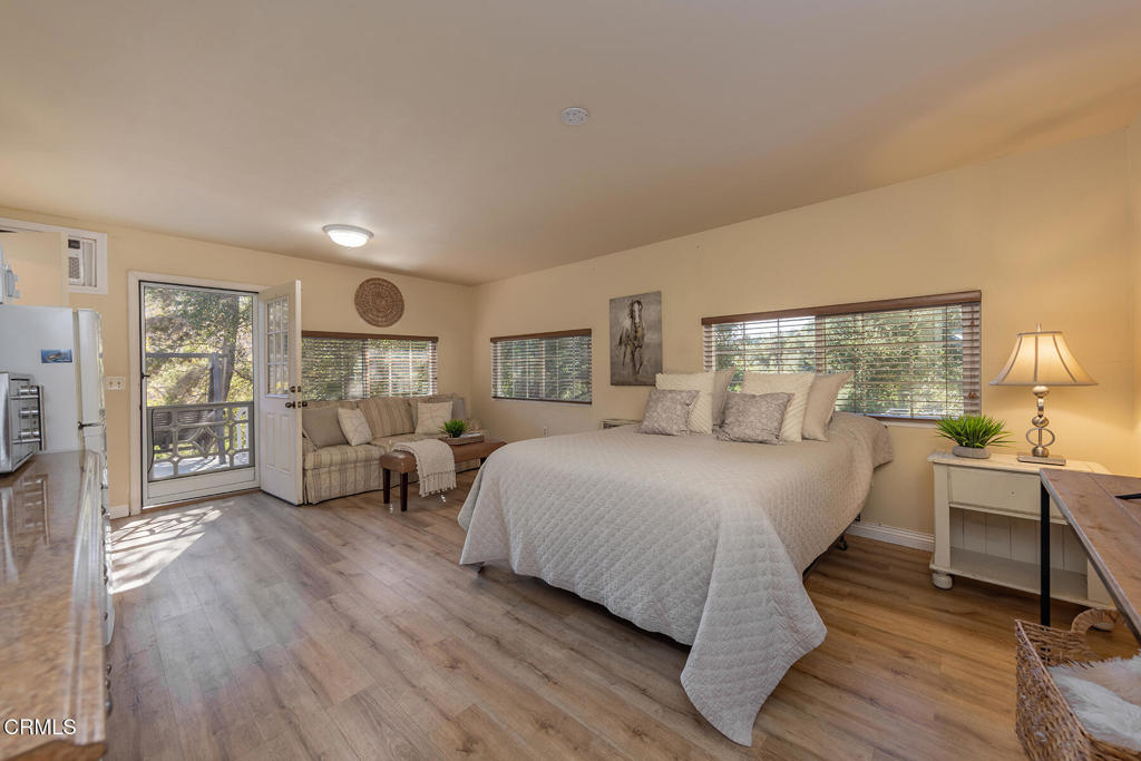 10522-62 Creek Road Ojai, CA 93023 - Photo 15 of 20 a bed room with a bed and a chair