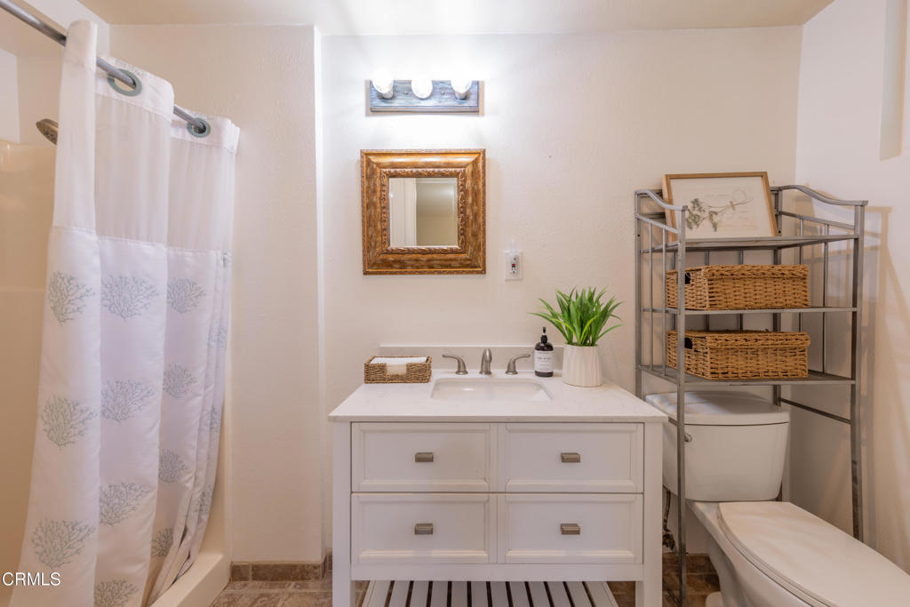 10522-62 Creek Road Ojai, CA 93023 - Photo 16 of 20 a bathroom with a sink a toilet and shower