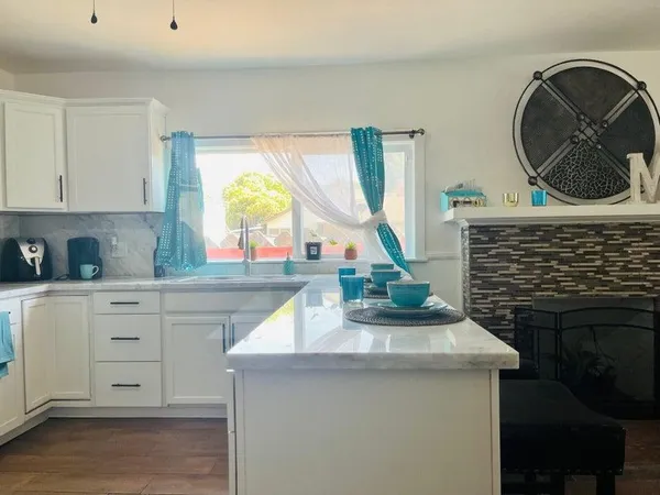 a kitchen with a sink and a stove