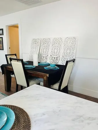 a bedroom with a bed and chair